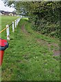 Track past the edge of a football pitch, Pentwynmawr