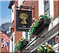 The Wheatsheaf: Signage, flag and flowers