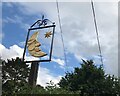 The sign of The Half Moon Inn