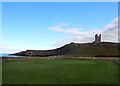 NU2521 : Dunstanburgh Castle - Across the golf course by Rob Farrow