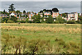 Houses above the River Severn, seen across meadows from Mountfields