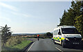 Cyclist and Ambulance on the B4248 Blaen-afon Road, looking west