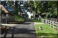 Footpath on track through buildings at Smiths Hill