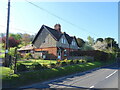 SU3428 : Houses on the A3057, Brook by JThomas