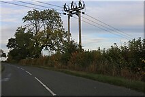 SP8159 : Power lines on Brafield Road, Lower End by David Howard