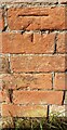 Benchmark on outbuilding at Red Lodge Farm on NW side of Hoby Road