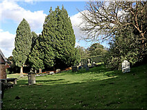 SJ7601 : Churchyard at St Milburga's in Beckbury, Shropshire by Roger  D Kidd