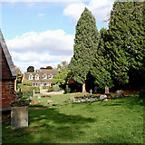 SJ7601 : Churchyard at St Milburga's in Beckbury, Shropshire by Roger  D Kidd