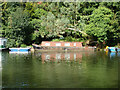 Scruffy narrow boat moored on River Thames