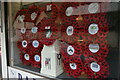 TM2483 : Remembrance display in butcher's window, Thoroughfare, Harleston by Christopher Hilton