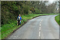 SX2957 : Dog-walkers on the A387 near Wildegates by David Dixon