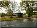 Bus shelter and mile post