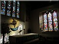 ST4676 : Lighting the altar by Neil Owen