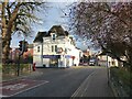 Road junction and estate agent office, with road sign, Evesham