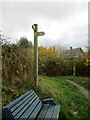 A  seat,  footpath  into  Bishops  Castle  and  a  finger post