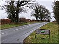 Looking south-east along the road to Lupin Farm