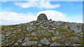 NN5698 : Geal Charn summit cairn by Colin Park