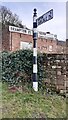 Cumberland County Council finger signpost on east side of road at Townhead