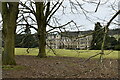 Audley End House and Garden: The house through a ring of Turkey oaks and other trees