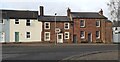 NY5261 : Row of houses on NW side of Carlisle Road opposite road junction by Roger Templeman