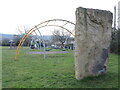 A large upright stone in the park