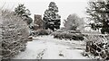 SJ5306 : View from the public footpath towards All Saints Church, Berrington, in the snow by TCExplorer