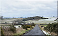 Road descending to junction at Hadwin