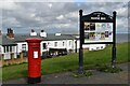 Letter box and Herne Bay information board