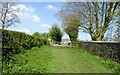 Footpath by a churchyard wall