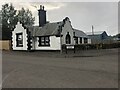 Black and white house on the corner of Station Road and Woodlea Court