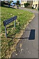 Meadow Road name sign and its shadow, Stonehouse