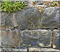 Cancelled benchmark on roadside wall, Bentley Lane, Meanwood