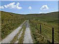 SJ0836 : The unclassified road approaching a junction by David Medcalf