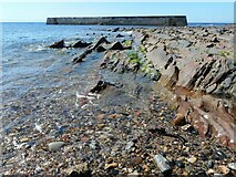 NO5201 : Rocky shore and breakwater by Richard Sutcliffe