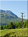 NG4226 : An enigmatic compositionmountains, trees, and the captivating presence of an electricity pole by Mick Garratt