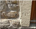 Benchmark cut into left side of stone door frame, Adel, Leeds
