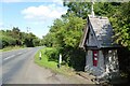 Country road passing a post box