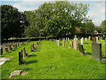 SE2028 : Looking north in the churchyard of St Paul's church, Birkenshaw by Humphrey Bolton