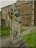 SE1017 : Mourner and cross sculpture in the graveyard of the Baptist Church at Salendine Nook by Humphrey Bolton
