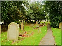 NZ1647 : Path in the churchyard, All Saints Church, Lanchester by Humphrey Bolton