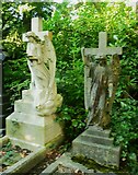 SE2639 : Two angels in the old part of Lawnswood Cemetery by Humphrey Bolton