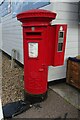 Elizabeth II postbox with attached stamp machine (disused), Bridge Stores, Potter Heigham