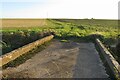 Farm track on a bridge over the brook