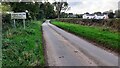 Entering Great Orton from the east with Mains Fauld houses on the right