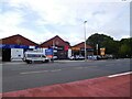 SJ8597 : Businesses on Ardwick Green South by Gerald England