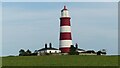 TG3830 : Happisburgh Lighthouse and Cottages by Sandy Gerrard