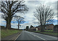 On the A49 heading east, farm buildings at Winter