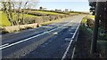 View of A596 from Bankend Bridge towards houses on the Pow road