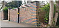 SP0585 : Old Brick Wall in Wheeleys Road with Benchmark by Paul Collins