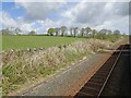 SH4871 : From a Chester-Holyhead train - Farmland and crossing near Gaerwen Isaf by Nigel Thompson